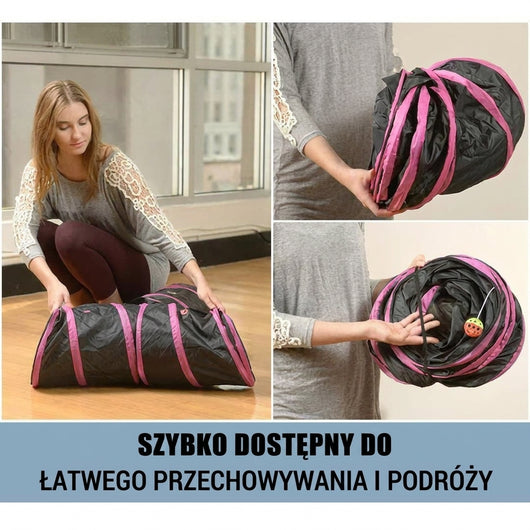 Kobieta składająca czarny tunel dla zwierząt z różowymi wykończeniami, który łatwo przechowywać i zabrać w podróż